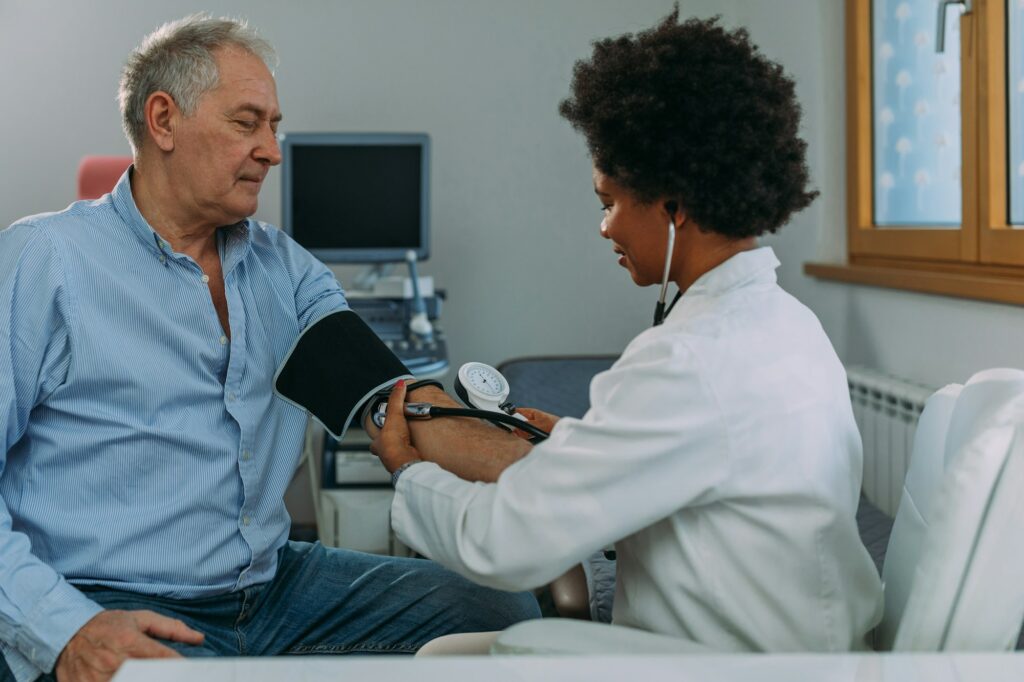 Older person is having blood pressure checked